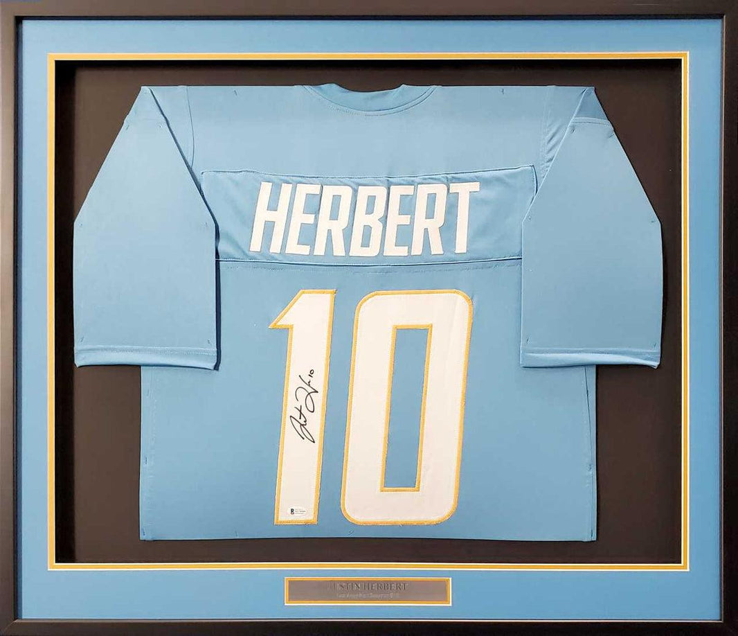 Custom autographed football jersey showing player signature and team-inspired colors without official team logos