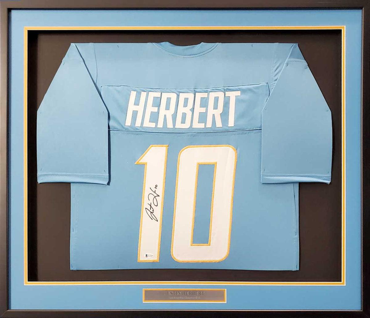 Custom autographed football jersey showing player signature and team-inspired colors without official team logos
