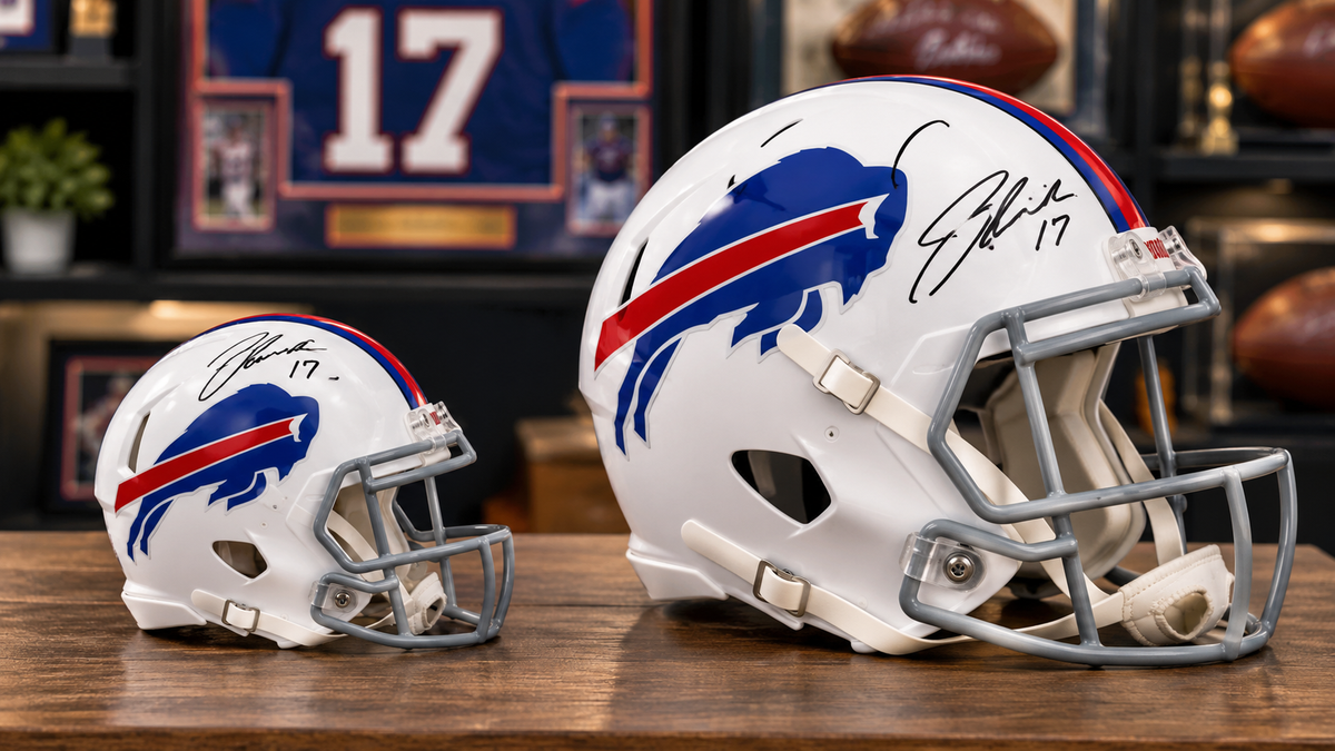 Autographed Buffalo Bills mini helmet compared with a full-size football helmet.